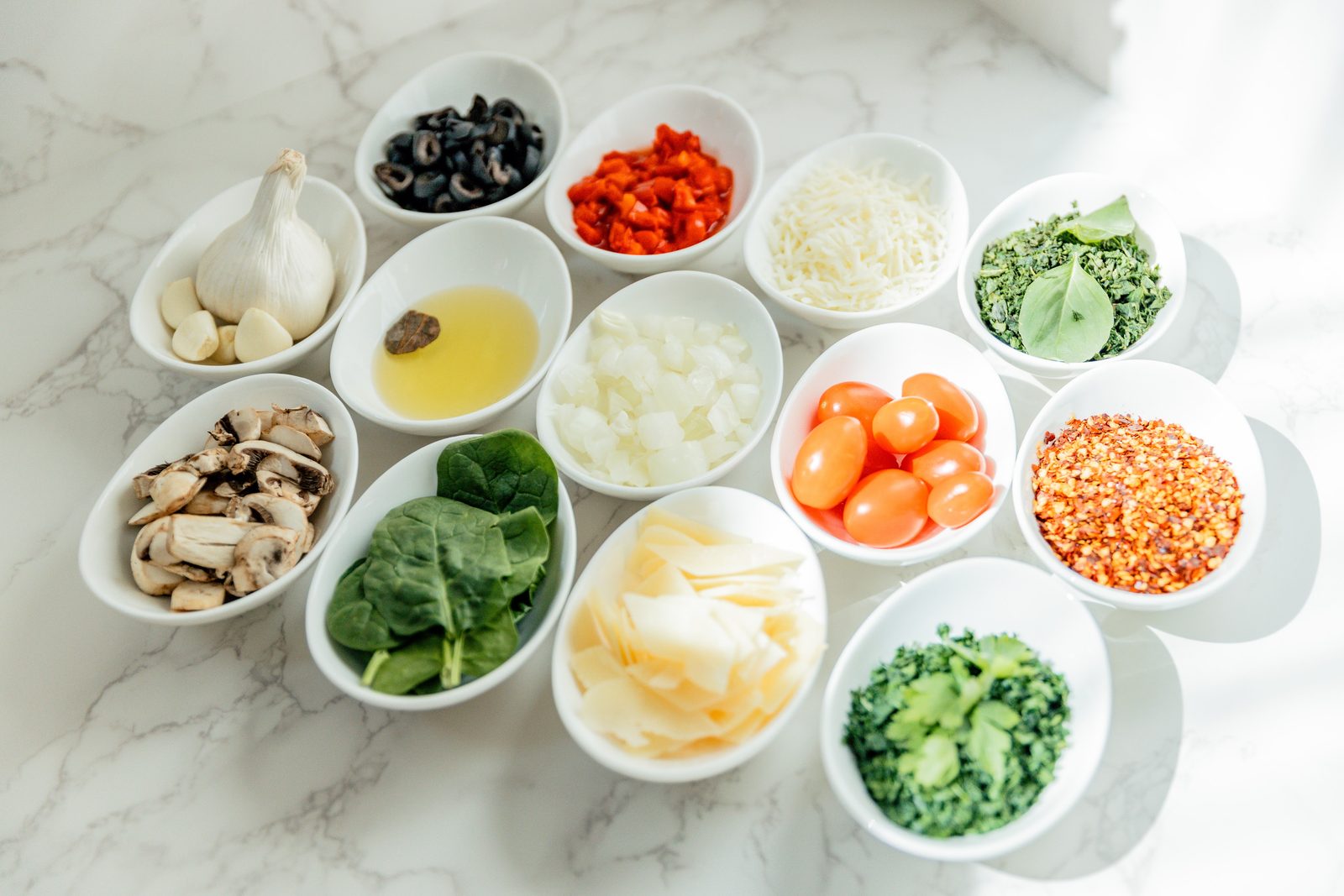 Bowls of fresh build-your-own pasta toppings
